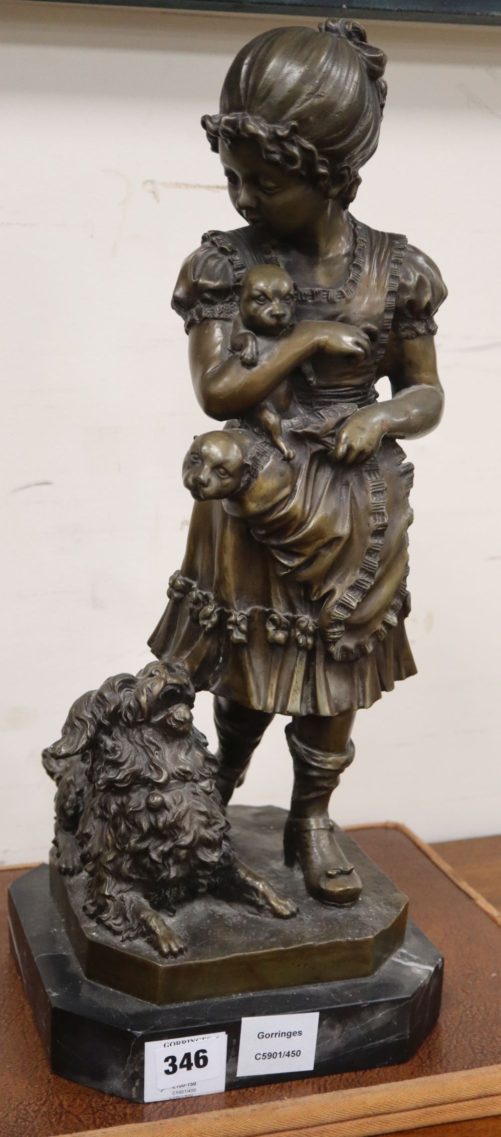 A modern bronze of a girl with a dog and puppies, height 51cm